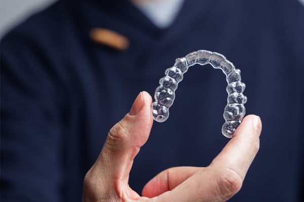 Invisalign is an increasingly popular orthodontic treatment– and with good reason! Invisalign allows wearers to straighten teeth discreetly and conveniently, with much fewer trips to the orthodontist.