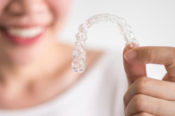 Invisalign is an increasingly popular orthodontic treatment– and with good reason! Invisalign allows wearers to straighten teeth discreetly and conveniently, with much fewer trips to the orthodontist.